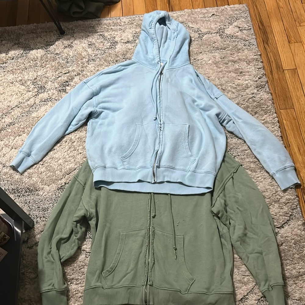 Two hoodies , size Medium , green and light blue
